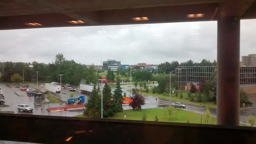 View looking southwest from the Loussac Library of Cuddy Family Midtown Park and the Midtown Post Office in Anchorage, Alaska